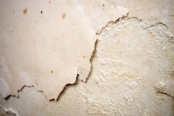 油漆潮湿的墙腐烂的油漆墙去皮