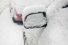 车镜子填满雪冬天季节白色雪覆盖车一边镜子