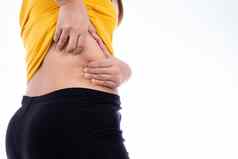 脂肪女人持有过度较低的回来超重高脂肪的孤立的白色背景饮食生活方式重量损失胃肌肉健康的概念