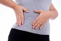 女人手触碰胃腰肝位置孤立的白色背景健康护理医疗概念