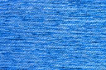 蓝色的平短硬绒毛密集的织物背景