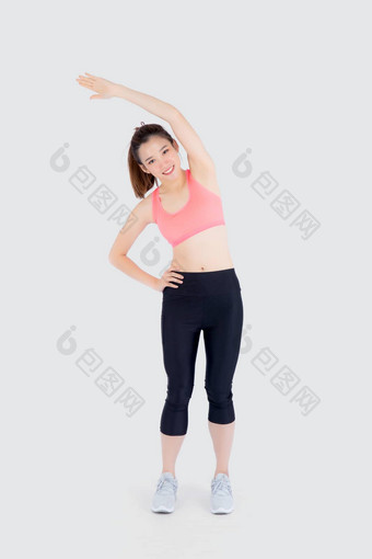 美丽的年轻的亚洲女人体育运动站拉伸肌肉手臂