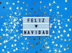 光盒子快乐圣诞节短语西班牙语快乐圣诞节蓝色的背景五彩纸屑