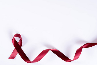 艾滋病意识红色的丝带白色背景复制空间文本世界艾滋病一天医疗保健医疗概念
