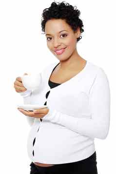 年轻的怀孕了女人饮料咖啡馆茶