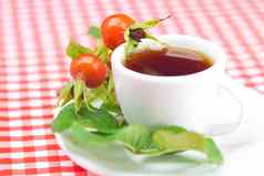 杯茶玫瑰果浆果叶子格子织物