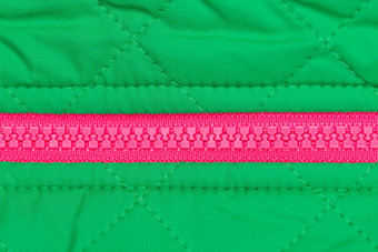 粉红色的拉链绿色织物