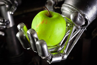 机器人手持有新鲜的苹果