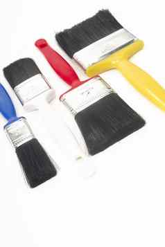 色彩斑斓的工具创建油漆刷躺白色