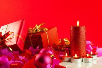 圣诞节礼物蜡烛红色的背景