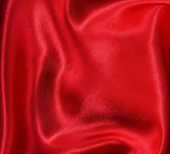 光滑的优雅的红色的丝绸背景光滑的优雅的红色的