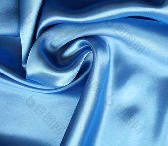 光滑的优雅的黑暗蓝色的丝绸背景光滑的埃莱加