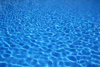 蓝色的瓷砖游泳池水反射纹理