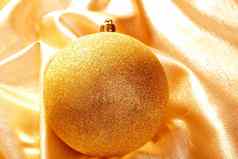 圣诞节黄金闪闪发光的小玩意金织物