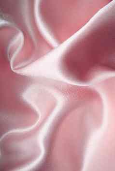 光滑的优雅的粉红色的丝绸背景