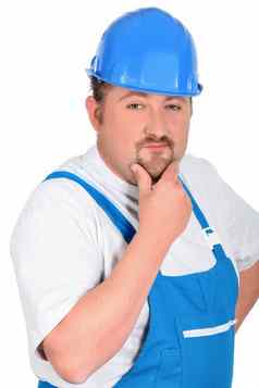 建设工人蓝色的工作服需要戴安全帽的