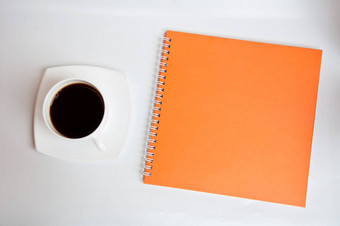 黑色的咖啡橙色笔记本