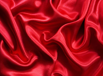 光滑的优雅的红色的丝绸背景光滑的优雅的红色的