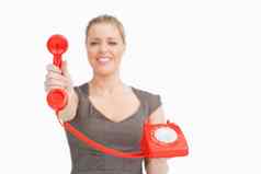 女人显示红色的复古的电话