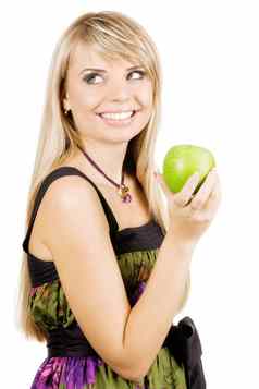 快乐的年轻的女人持有新鲜的苹果