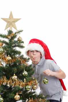 男孩圣诞老人他坚持舌头圣诞节树