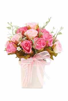 粉红色的玫瑰花瓶孤立的白色