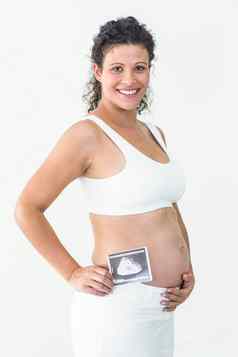 微笑怀孕了女人持有超声波扫描
