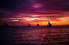 难以置信的美丽的日落帆船地平线长滩岛岛