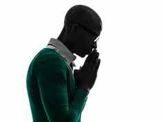 非洲黑色的男人。思考沉思的祈祷轮廓