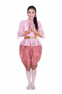 女人穿典型的泰国衣服支付尊重孤立的白色