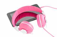 充满活力的粉红色的女耳机黑色的平板电脑