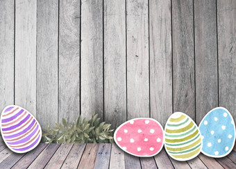 复活节色彩斑斓的鸡蛋水彩木背景