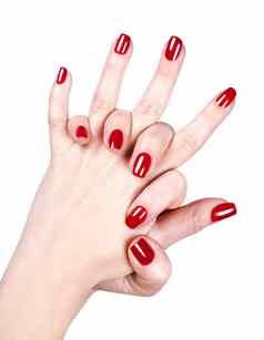 女人的手红色的指甲波兰的