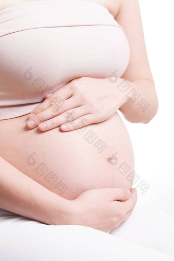 美丽的肚子年轻的有吸引力的怀孕了女人白色背景