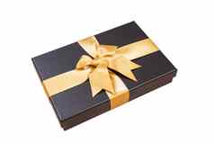 黑色的礼物盒子黄金丝带弓白色背景