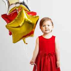快乐孩子色彩斑斓的闪亮的箔气球