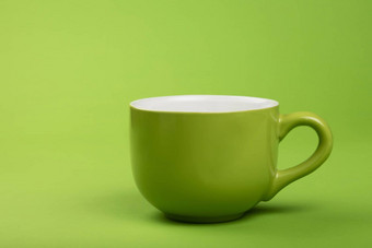 完整的大咖啡茶杯绿色纸