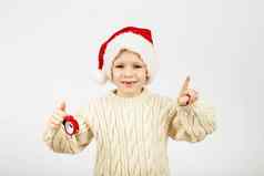 肖像快乐快乐的美丽的男孩穿圣诞老人他