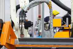 工业焊接机器人手臂焦点模糊焊机背景