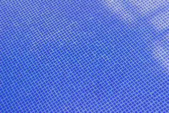 蓝色的瓷砖游泳池背景