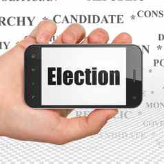 政治概念手持有智能手机选举显示