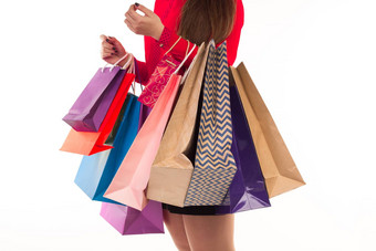 女人持有购物购买五彩缤纷的纸袋