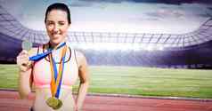 复合图像肖像快乐女运动员显示奖牌