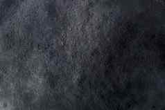 黑暗灰色黑色的板岩背景纹理详细的真正的真正的石头自然