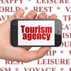 旅游概念手持有智能手机旅游机构显示