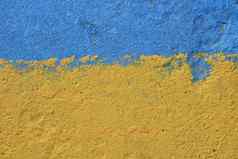 蓝色的黄色的画混凝土墙纹理