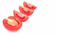 特写镜头新鲜的红色的西红柿片白色背景食物