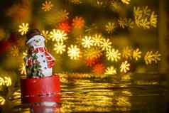 圣诞节雪人花形状的灯背景