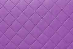 细节紫色的缝皮革粉红色的皮革室内装潢背景模式