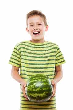 英俊的微笑孩子男孩持有绿色西瓜水果